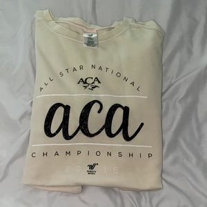 varsity spirit crew neck, size Large, good condition, cream color